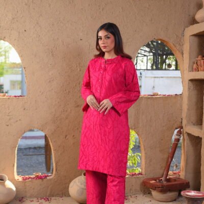 girl in pink paradise attire standing in a rustic outdoor setting with pottery.
